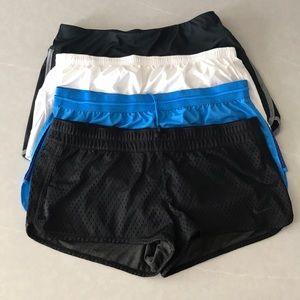 3 Pairs of Nike shorts, One pair of Mizuno. XL